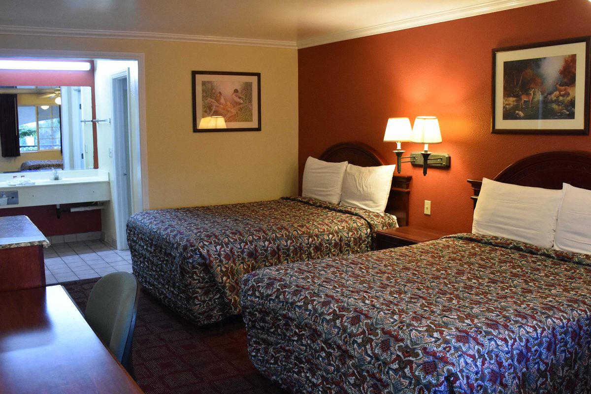 Two queen guest room at Dynasty Suites Santa Fe Springs